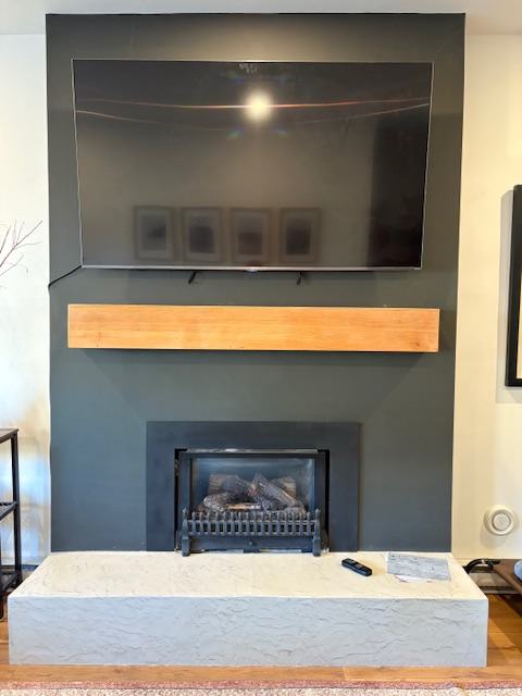 Fireplace mantel and TV wall